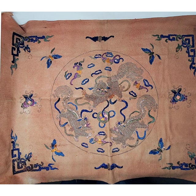 Here is a vintage intricately hand embroidered cloth measuring 36" x 26" featuring a Chinese design of mythical creatures,...