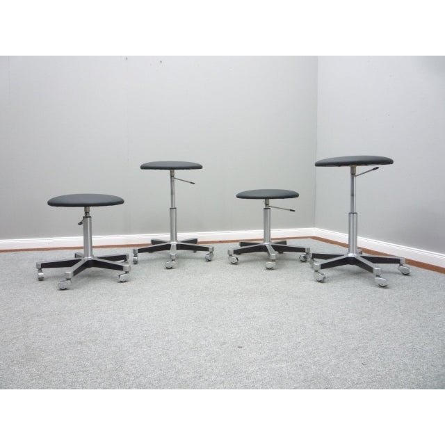4 round stools from Olymp. The seats were reupholstered with black leather. Frame made of aluminum, metal and chrome...