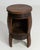 A magnificent example of early twentieth-century French craftsmanship, this oak barrel bar table transforms a storied...