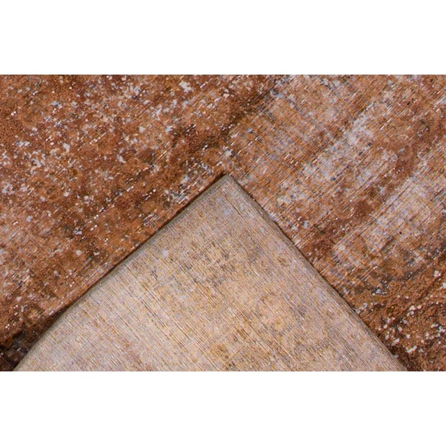 Vintage hand-knotted Overdyed rug with a medallion floral motif. This piece has great detailing and a beautiful design. It...