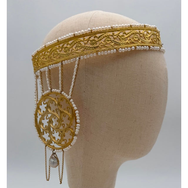 Chiseled gilt bronze crown with medallions, signed St. Louis Paris This chiseled bronze crown features foliage and flowers...