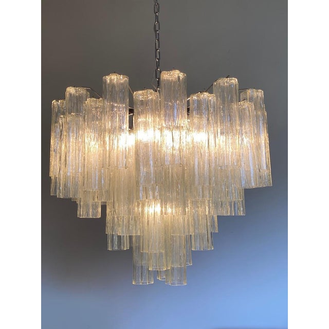Contemporary champagne “tronchi” Murano glass chandelier. Scenographic and luxury chandelier, all made in Italy, made in...