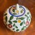Hand painted plum design ginger jar with lid. Commonly produced in China, often featuring a "Zhongguo Zhi Zao" stamp on...