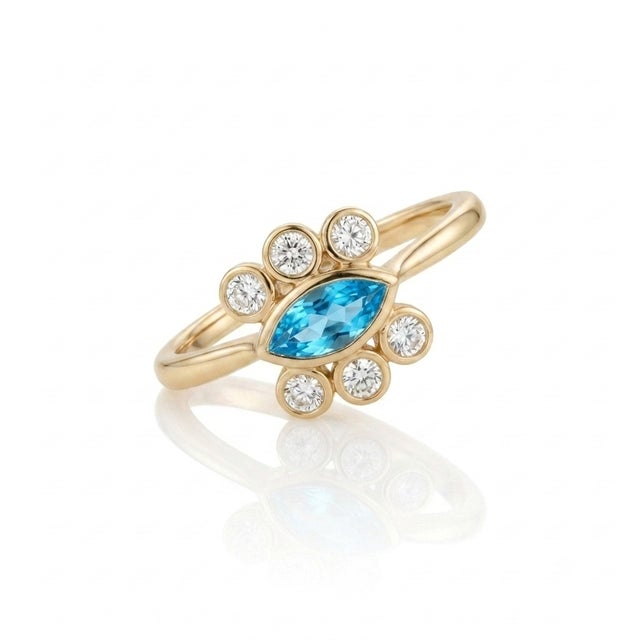 Make a vibrant statement with this unique marquise-cut London Blue Topaz ring. Featuring a striking 8x4mm center stone...