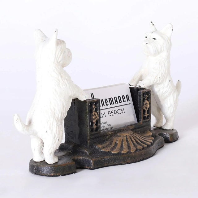 Vintage cast iron card holder with a pair of terriers in service as greeters.