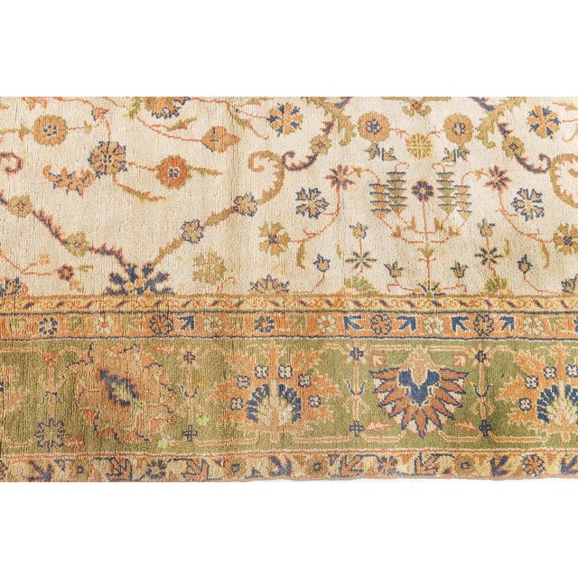 This exquisite early 20th-century Turkish Oushak rug is a true masterpiece of traditional Anatolian craftsmanship. This...