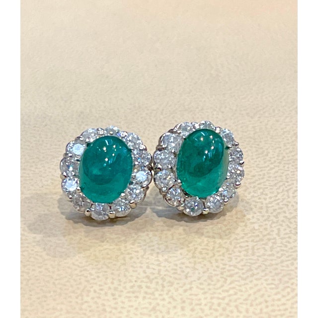 Approximately 12 Carat of Natural Zambian Emerald Cabochon and 4 Ct diamonds earrings in White gold Each Emerald Cabochon...