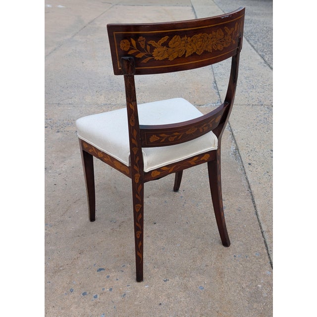Exquisite 19th-century antique mahogany side chair featuring intricate floral wood inlays and classic period...
