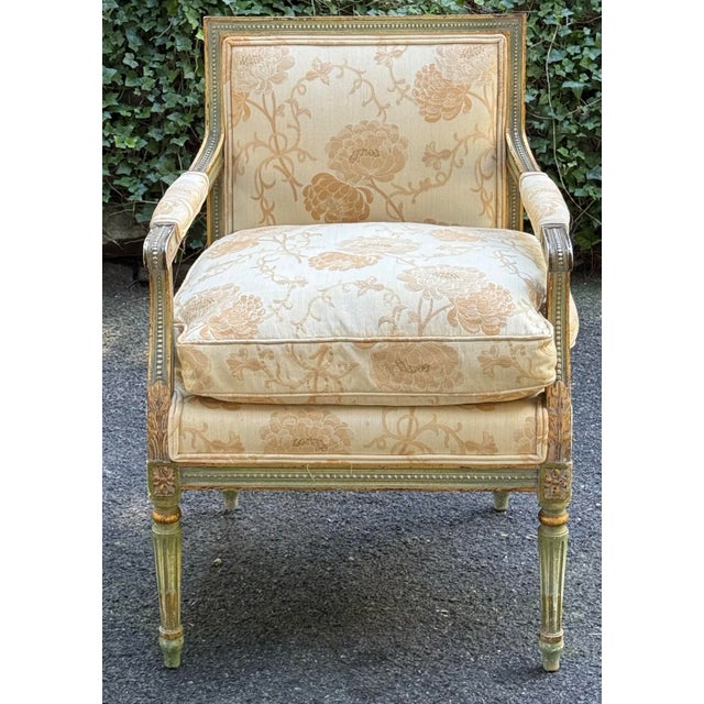 Gorgeous one of a kind French regency chair with painted finish and gold leaf highlighting the carved details. Elegant...