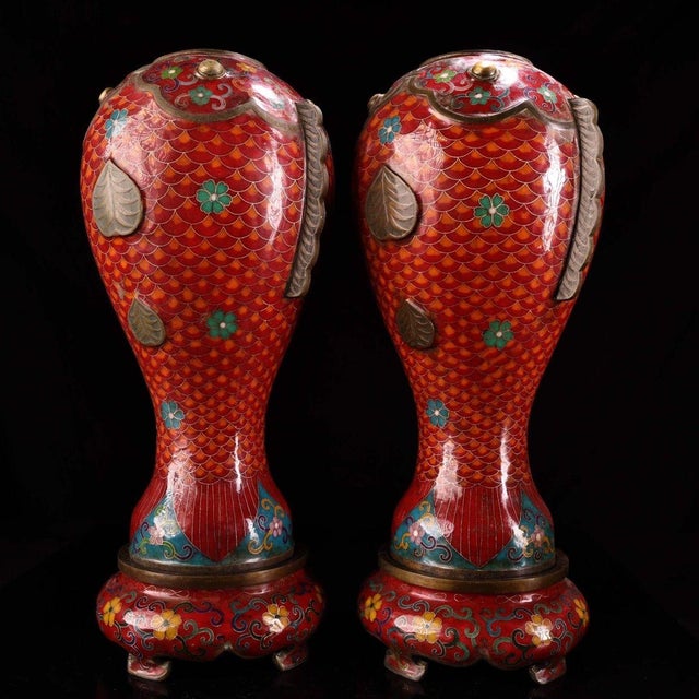 This charming pair of fish-form vases is crafted from a bronze body and richly decorated with cloisonné enamel. Each vase...