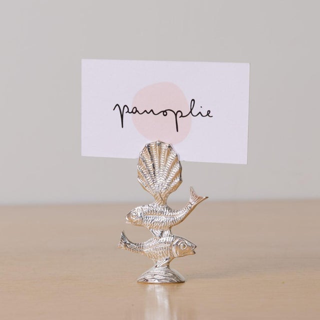 Great set of 9 decorative silver toned place card holders with two stacked fish and scalloped shell. Thin opening in shell...