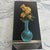Spectacular original painting signed Joseph Vella. Features a still life of a luninous turquoise vase and yellow flowers...