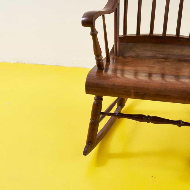 Discover the timeless elegance of this vintage wooden rocking chair, perfect for enhancing any space. With a refined...