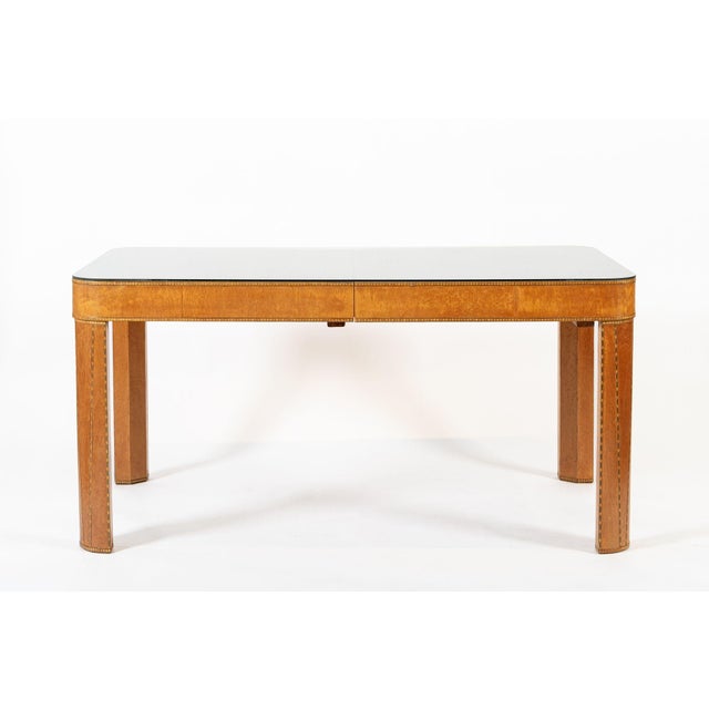 This beautiful antique Art Deco wooden dining room table is circa 1940. The table is exceptionally well-crafted from solid...
