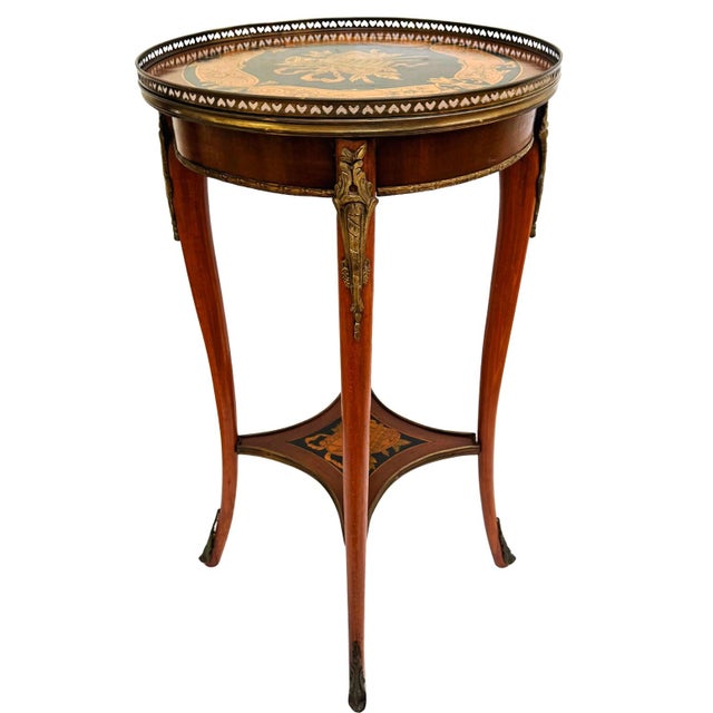 A 19th century antique pair of occasional side tables (guéridons) in the Louis XVI Neoclassical style, featuring inlay...