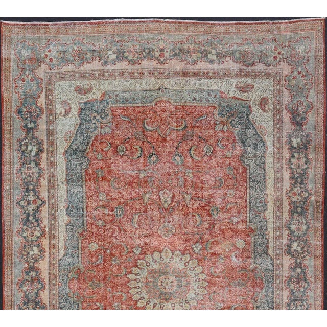 Large Antique Persian Mahal Rug with a Traditional Medallion and Floral Design in red, blue, green, ivory. Keivan Woven...