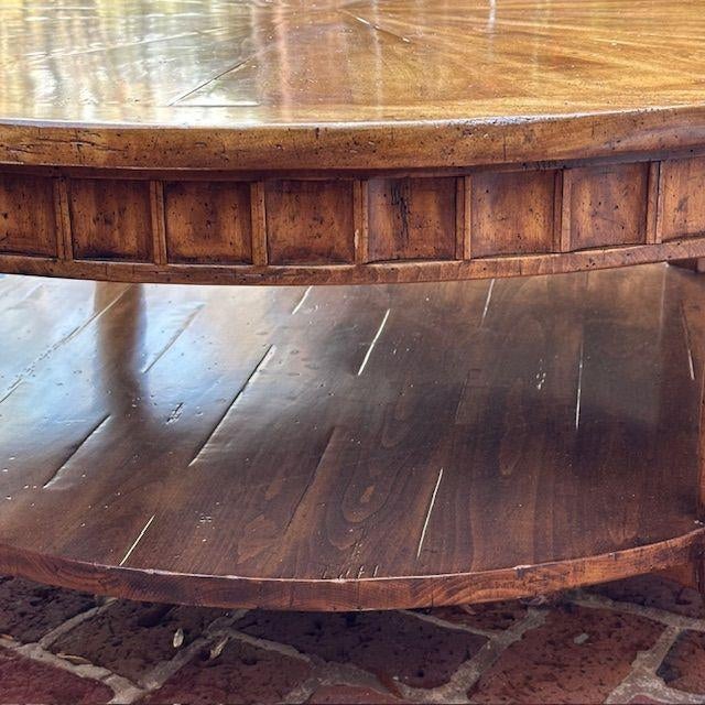 A gorgeous mitered sunburst coffee table with high low planking that is sure to please. The hand carved block panel apron...
