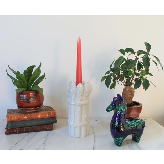 Vintage white ceramic asparagus form candle holder. One rough spot on tip of asparagus. Pictured. No makers mark.