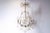 A French nine-light crystal chandelier from the mid-19th century, with iron armature. Born in France during the reign of...