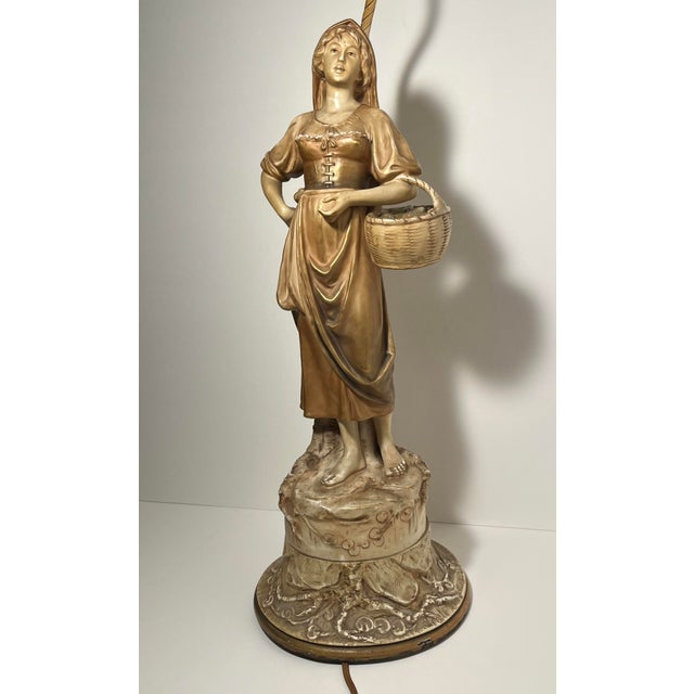 Beautiful circa 1920s J.B. Hirsch figural table lamp featuring a finely modeled porcelain figure of a young village woman...