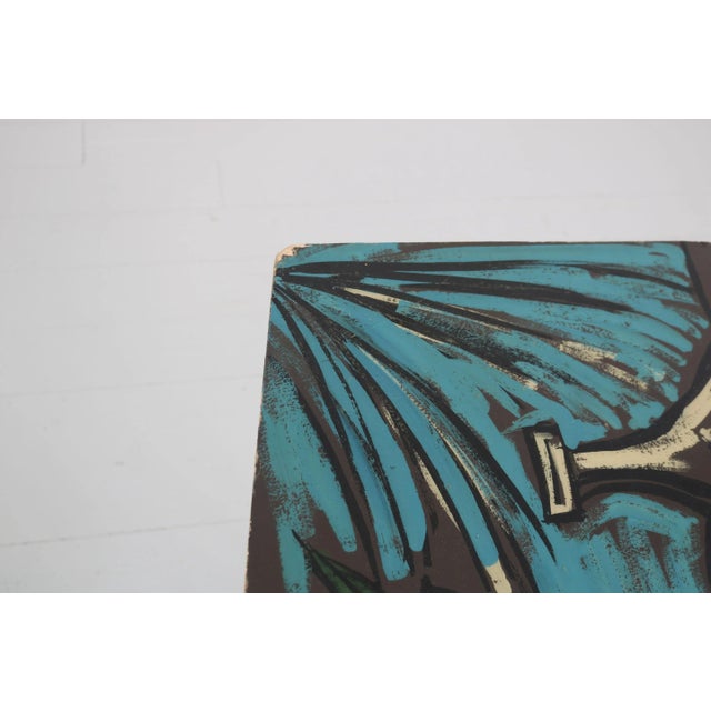 This sofa table was designed in the 1950s. The table frame is made of lacquered iron and brass, the angular table top is...