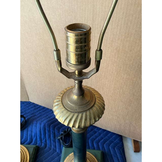 Channel the refined elegance of a bygone era with this exquisite pair of vintage brass and marble table lamps. Standing...