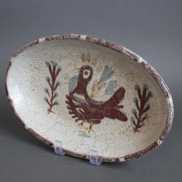 Mid-century French ceramic tray by Gustave Reynaud for Le Mûrier (circa 1960s). Oblong-shaped tray in rustic Provençal...
