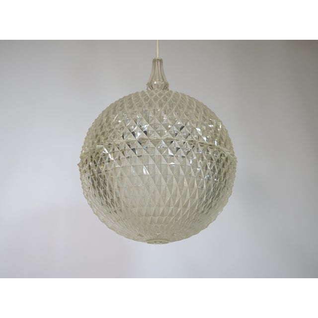 Vintage design ceiling lamp by Aloys Gangkofner for Erco, 1970s. Spherical light fixture made of textured plastic with a...