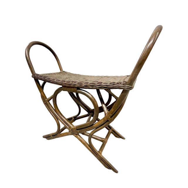 A wonderfully unusual vintage woven rattan and bamboo stool with an architectural, sculptural form. The handwoven seat is...