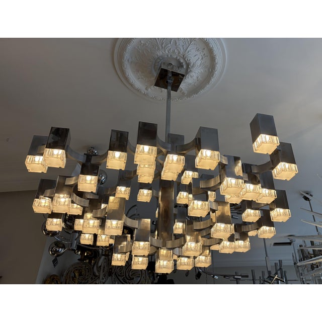 Large italian mid-century cubic chandelier by gaetano sciolari from 1970s. the chandelier is made in chrome with acrylic...