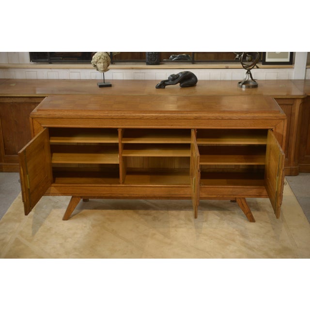 Superb brutalist/modernist oak sideboard, typical of the 1960s. The front is worked in geometric high relief (motifs...
