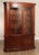 High Quality American Made Large Mahogany Two-Piece China Cabinet Opening to Glass Shelves and Lighted Interior, Key Locking