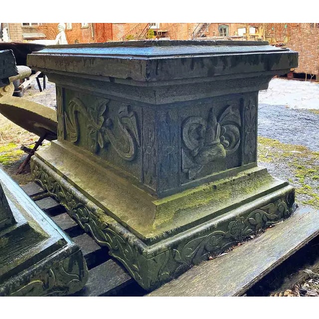 Pair of late 20th century granite architectural bases. Carved on all four sides.