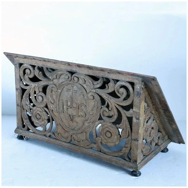 DETAILS An antique slanted table-top lectern or missal stand. Handcarved with the Christian monogram for Christ IHS with...