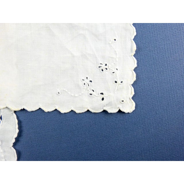 Pair of fine white cotton lawn hand embroidered scallop edge white cutwork hankies. Very soft, few tiny spots.