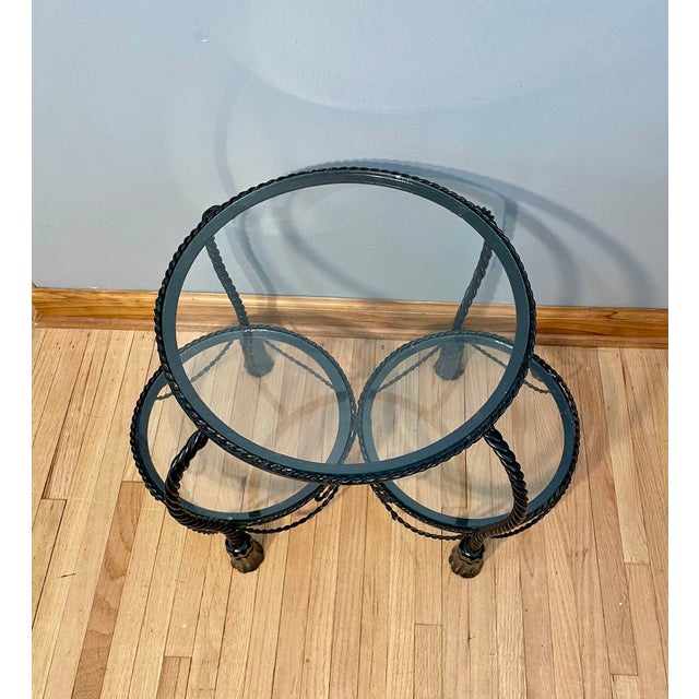 Unmarked Vintage Italian Hollywood Regency 3 Tier Black Iron Rope Tassel Stand Side Table Item features 3 round tiers...