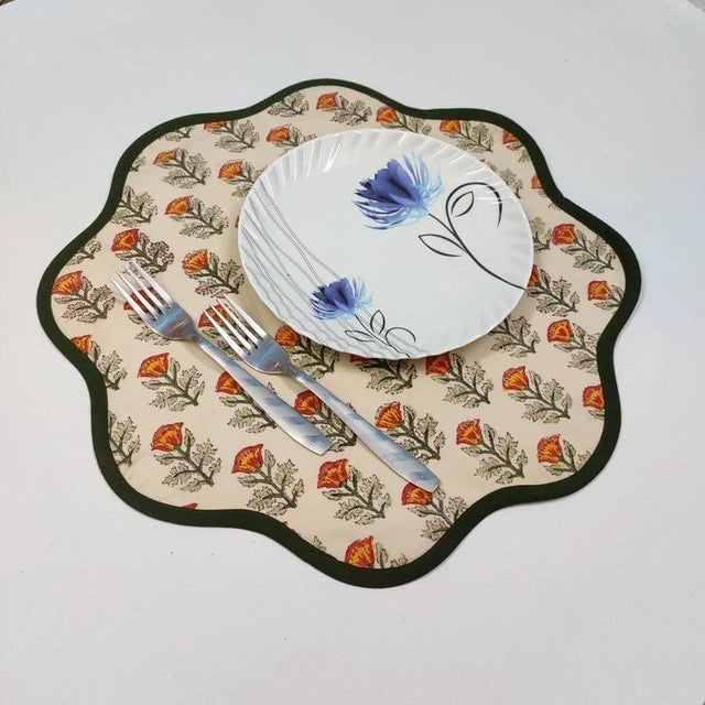 A beautiful set of round scalloped placemats in a pretty fall/autumn floral print in a festive colored piped edge. This...
