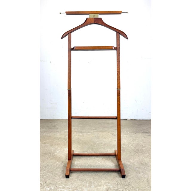 A nice circa 1970’s Italian valet by Fratelli Reguitti. Marked “Brevettato” for “patented” in Italian. Made of beechwood...