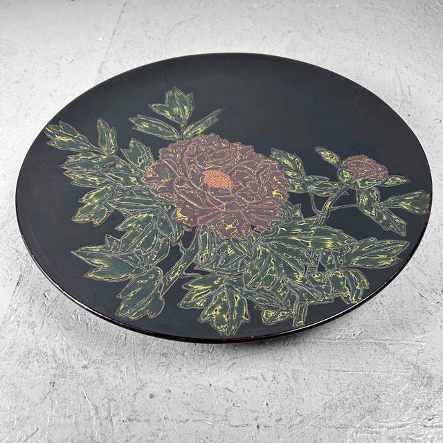 Highly decorative Japanese wooden bowl finished with lacquerwork. The bowl features a lavish floral design intricately...