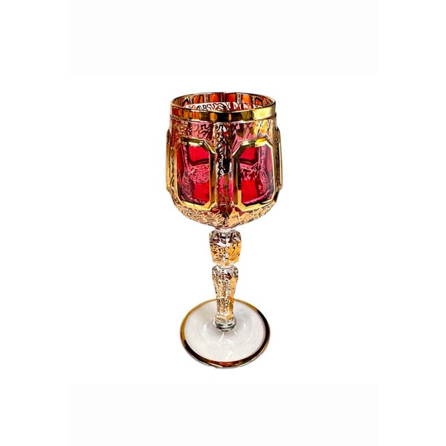 A stunning set of luxurious Bohemian cranberry cut to clear gold gilded stemmed cordial glasses by renowned fine quality...