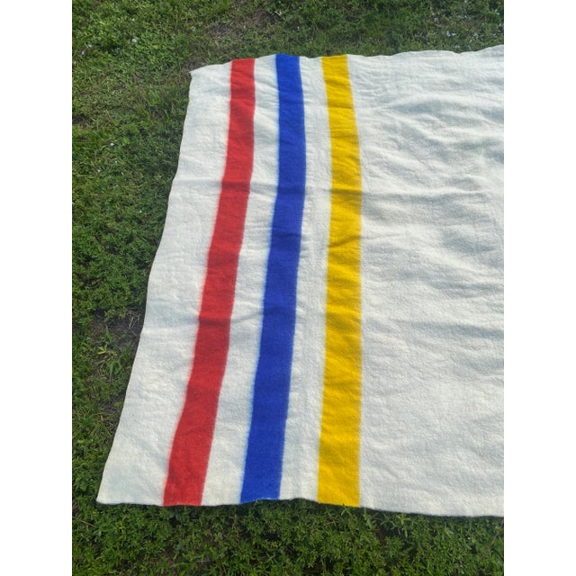 Vintage Hudson Bay Style Midcentury White With Red, Blue, and Yellow Striped Wool Blanket For Sale - Image 4 of 10
