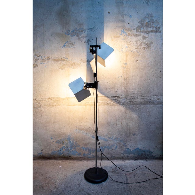 Two-light floor lamp in lacquered and chromed metal. Orientable and height adjustable. Trihedron model Designer Joe...