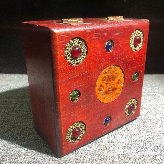 This exquisite vintage wooden box is a stunning example of traditional Chinese craftsmanship. Crafted from a rich,...