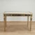 Striking vintage three drawer desk with brass hardware, crafted in hardwood in classic form, with a gold tone finish...