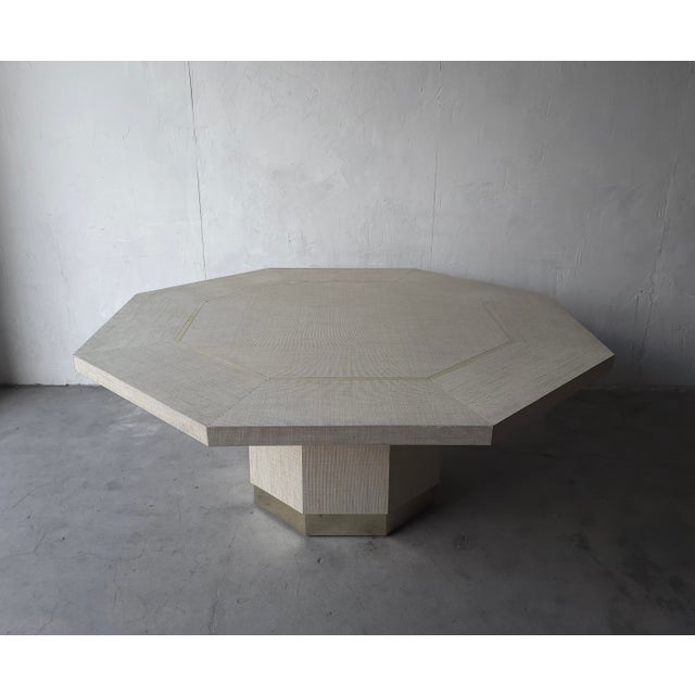 Big on size and style, this striking 1970s, octagonal dining table is fully wrapped in natural grasscloth, accented with...