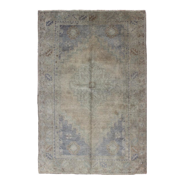 Vintage Turkish Oushak Rug With Muted Colors and Central Medallion Design For Sale