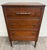 This is an antique late-Victorian walnut chest of drawers dating to the early 1900s. It features three spacious dovetailed...