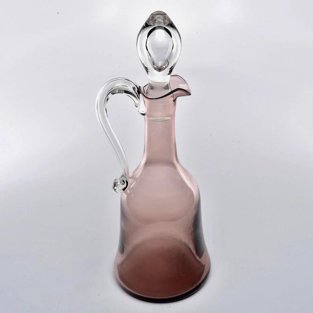 Circa 1970s Murano glass decanter in smoky amethyst hue with clear glass handle and stopper. No flaws found.