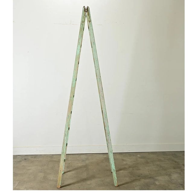 Dimensions: 91 ½” H x 22 ⅝” W x 32” D A 19th century English folding ladder easily adapted for displaying textiles or...