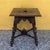 This charming antique stool or side table in the historicist style dates from the turn of the century and impresses with...